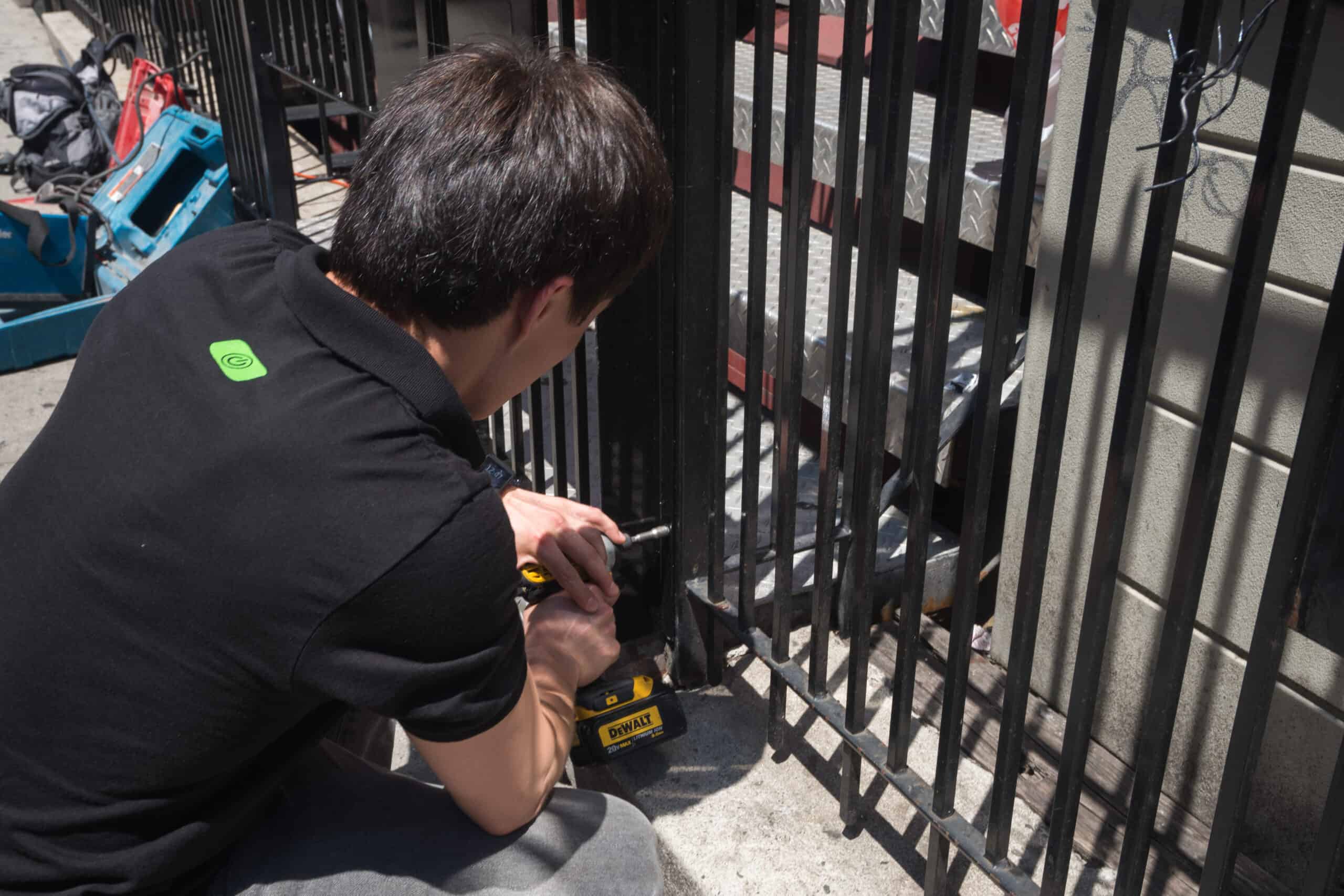 Engineer performing electric gate repair in London